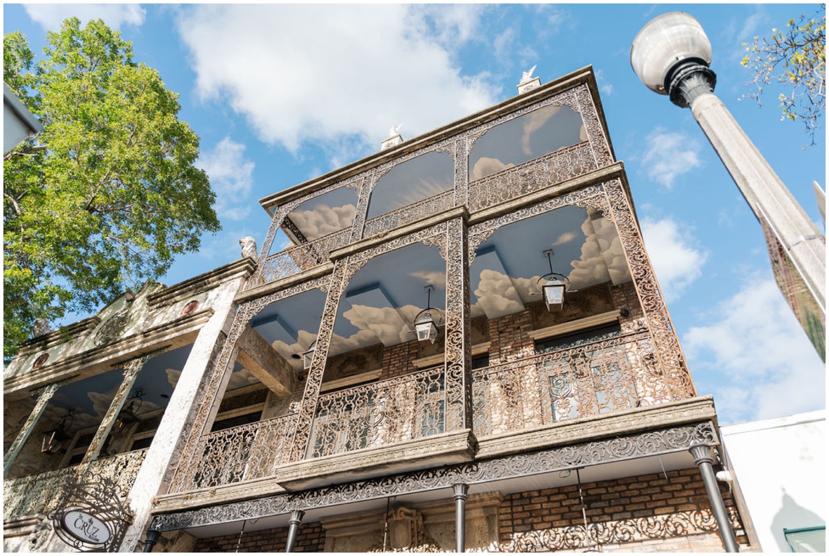 Details of an ornate balcony with sky painted on the ceiling at one of the wedding venues in Miami