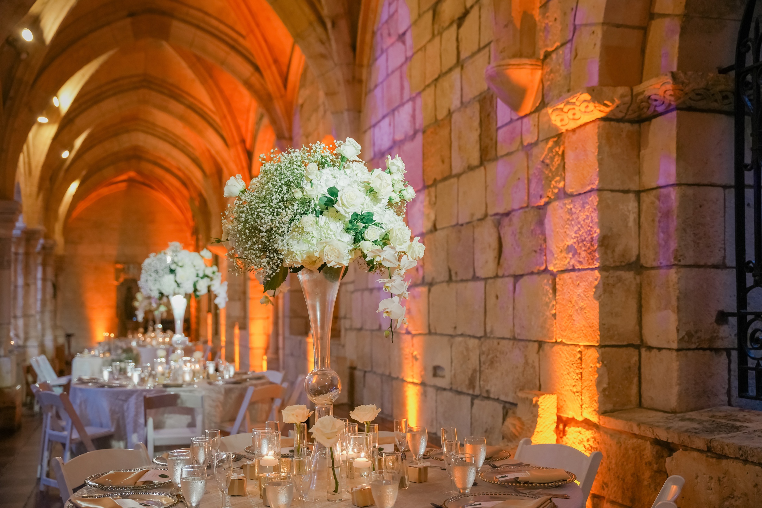 Details of an indoor reception table set up with lights in one of the european style wedding venues in florida