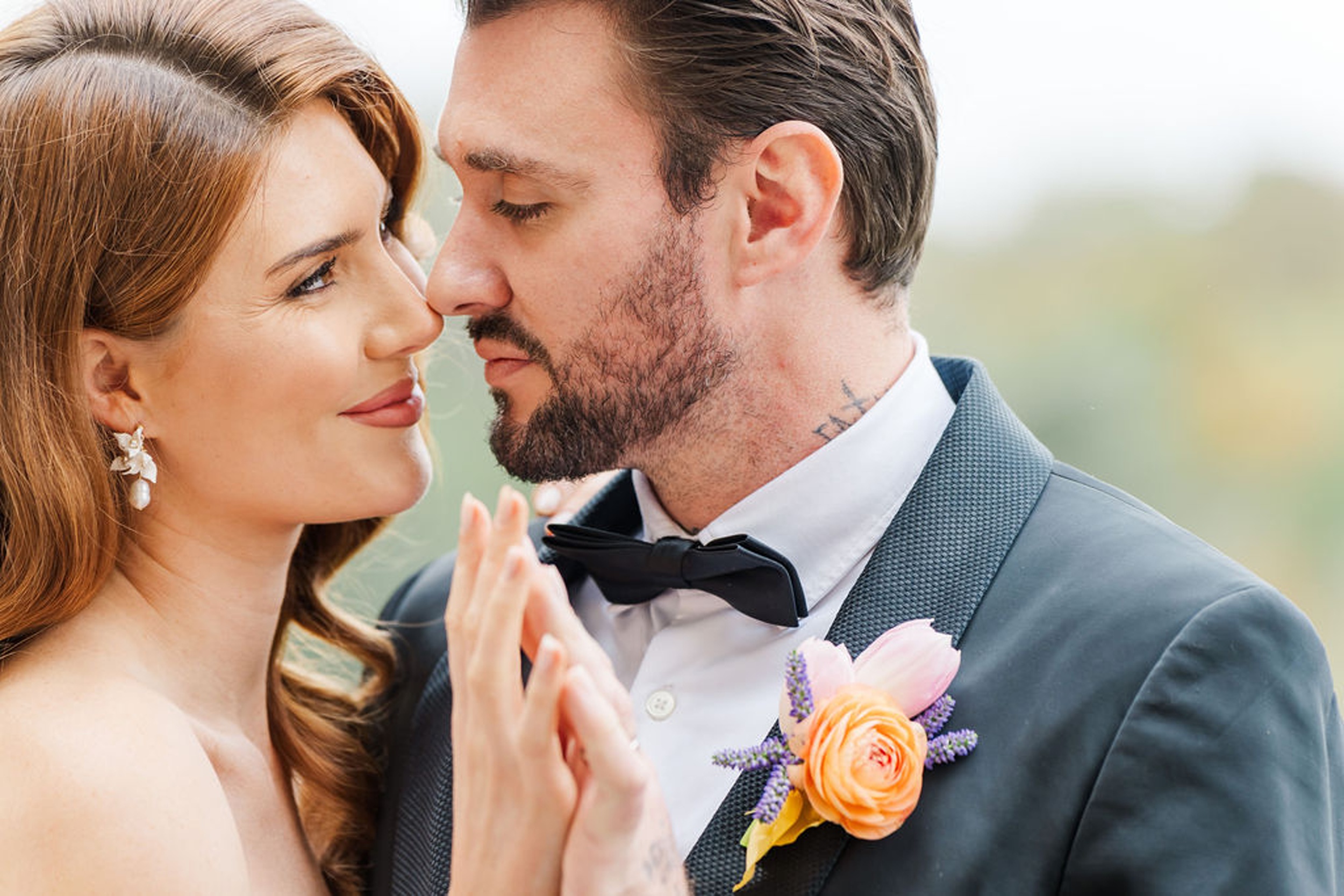 Newlyweds lean in for a kiss while dancing close at one of the wedding venues in naples florida